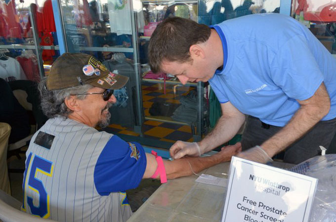 Dr. Anthony Corcoran conducts a PSA screening