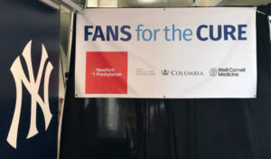 The event banner showing logos of the Yankees, NYP, Columbia, Weill Cornell, and Fans for the Cure