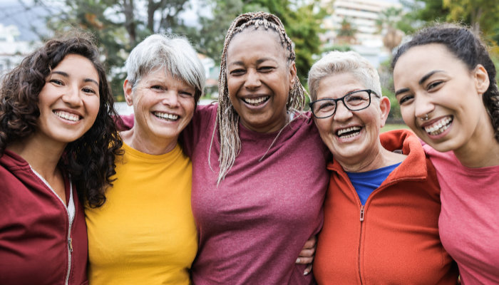 A group of women with arms around each other