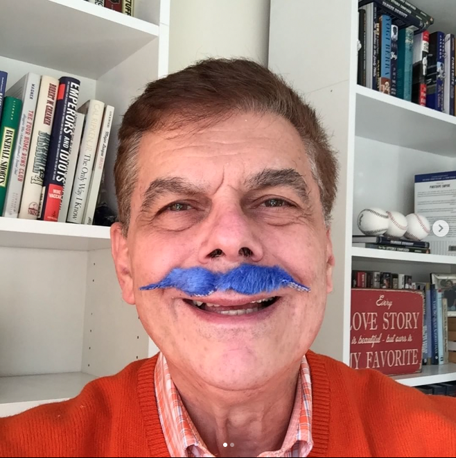 Ed Randall wearing a silly blue mustache