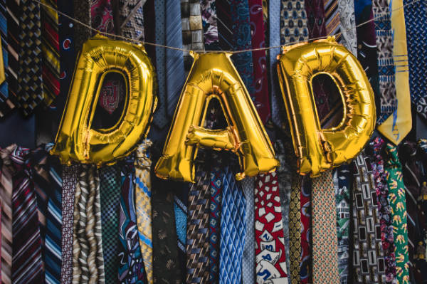 Dad in balloons overlaid on ties