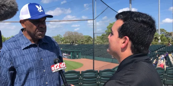 Andre Dawson being interviewed by a reporter at the Andre Dawson Classic