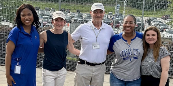 The Fans for the Cure team at a ballpark