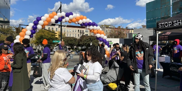 Fans for Cure attending a health fair in a local community