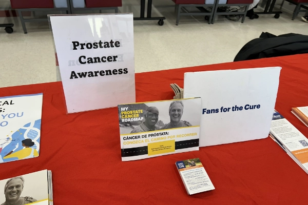 A Fans for the Cure table at a health event in the community