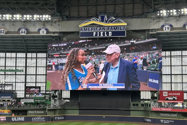 Fans for the Cure's interview displayed on the jumbotron in Milwaukee